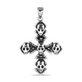 Colgante de cruz con múltiples calaveras de acero inoxidable